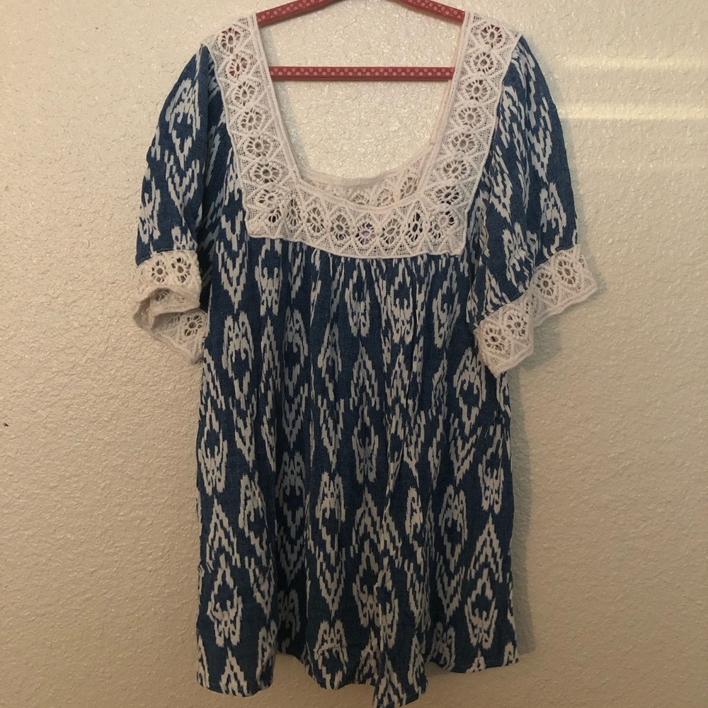 Blue top with lace trim around neck and arms